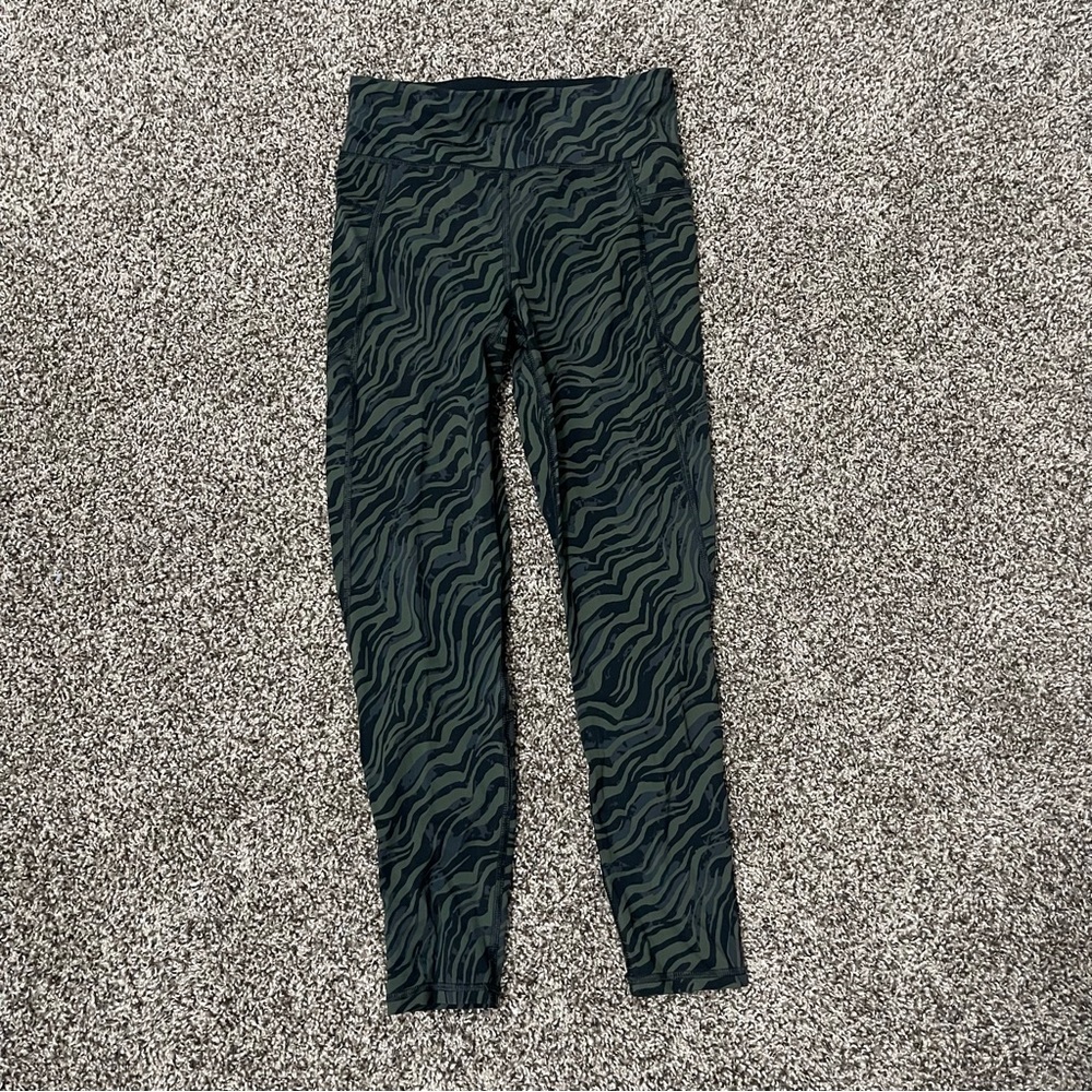 Sweaty Betty Zero Gravity High-Waisted 7/8 Leggings in a green zebra print